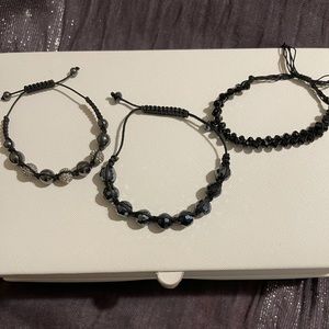 Three, glass-bead, string-threaded, adjustable bracelets.  Selling as a package.